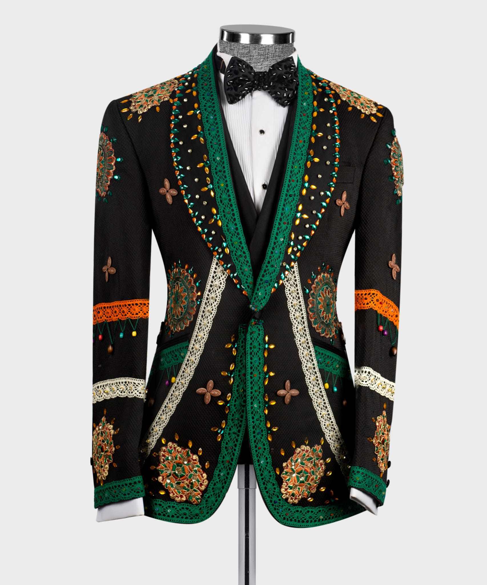 Black tuxedo jacket with green satin lapels and ornate crystal-embroidered motifs