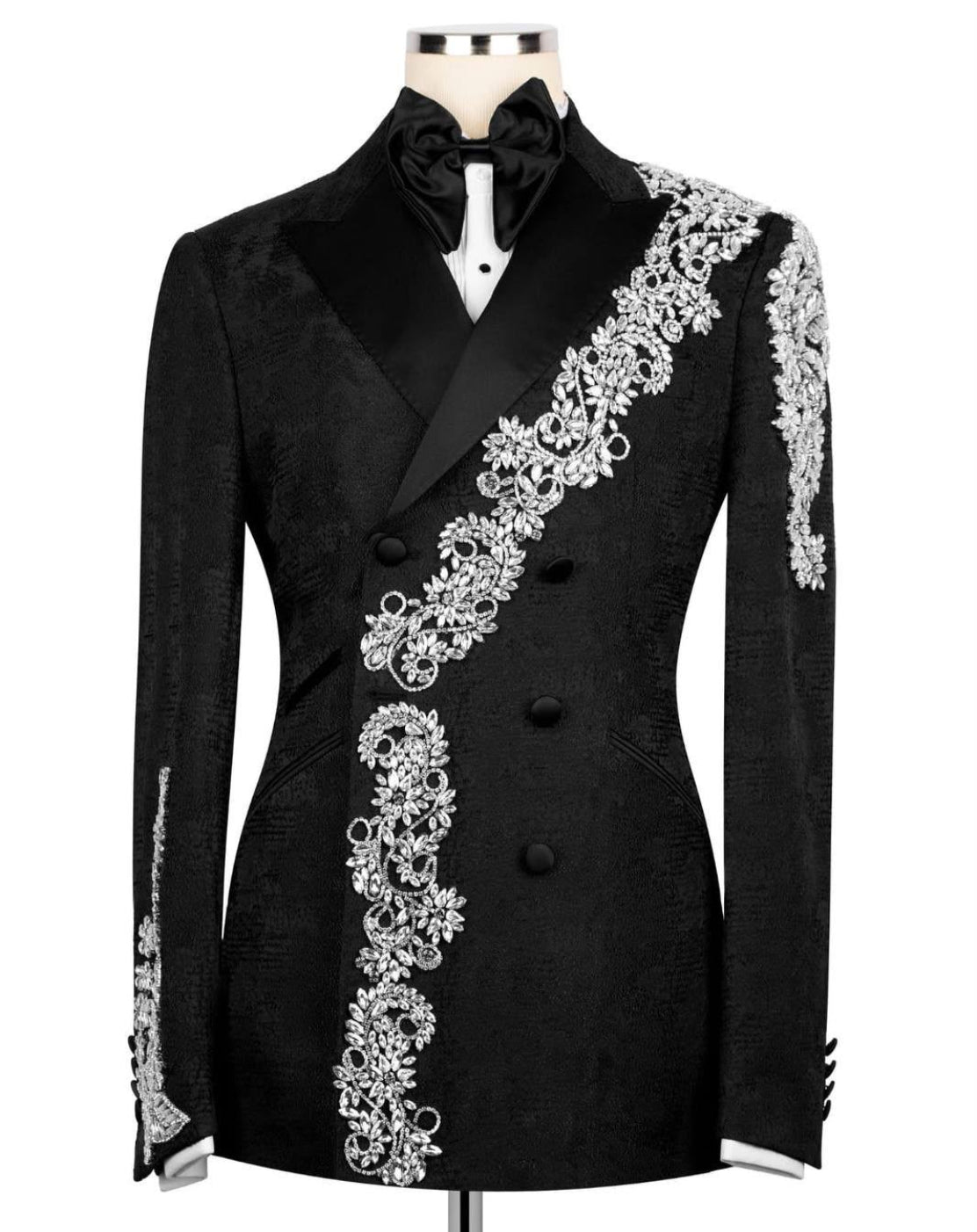 Black formal jacket with white embroidery on a mannequin