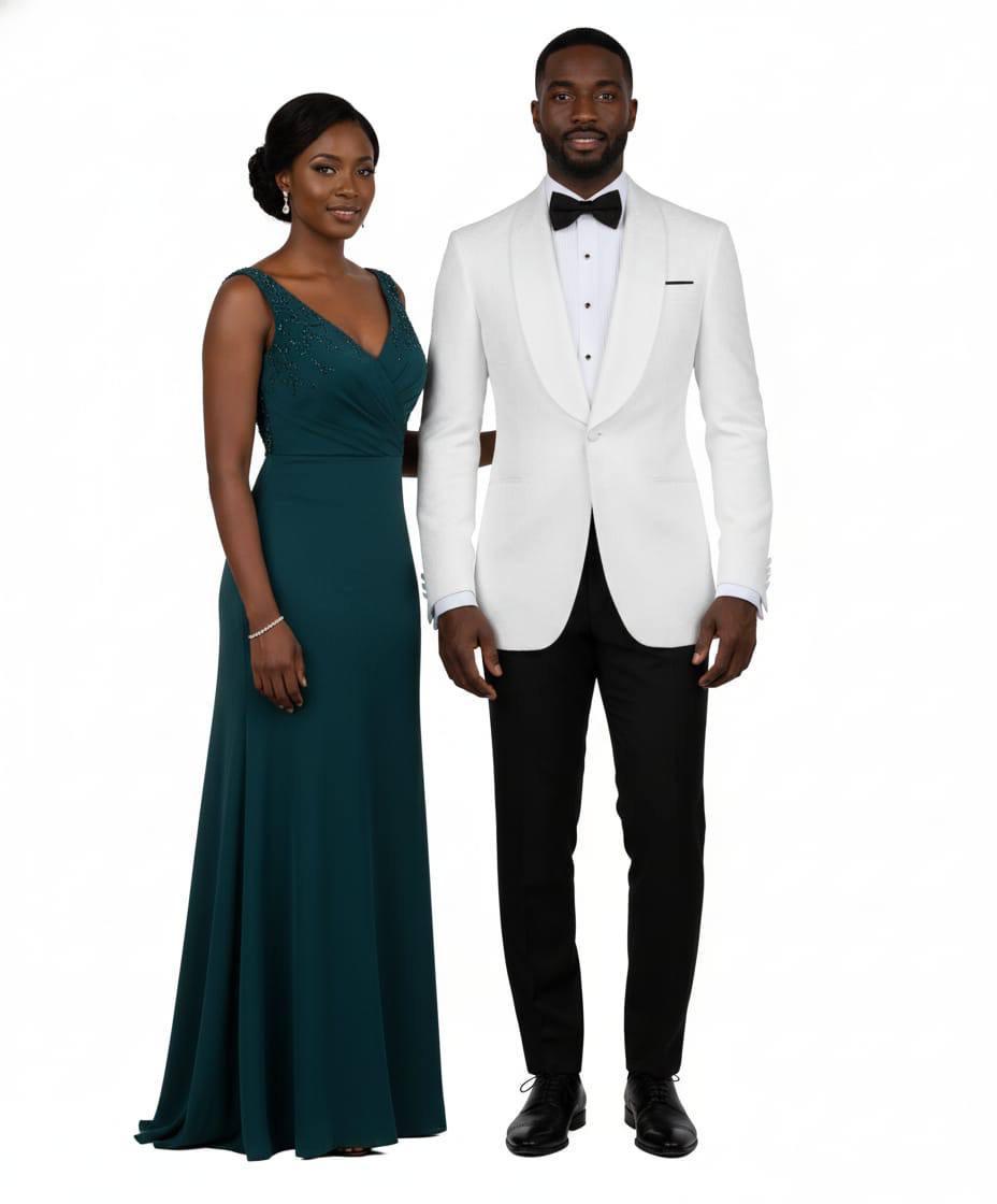 A man and a woman standing side by side against a plain white background. The woman wears a floor-length teal green gown with a V-neckline, and the man wears a white tuxedo jacket with black shawl lapels, a white dress shirt, a black bow tie, black trousers, and black dress shoes.