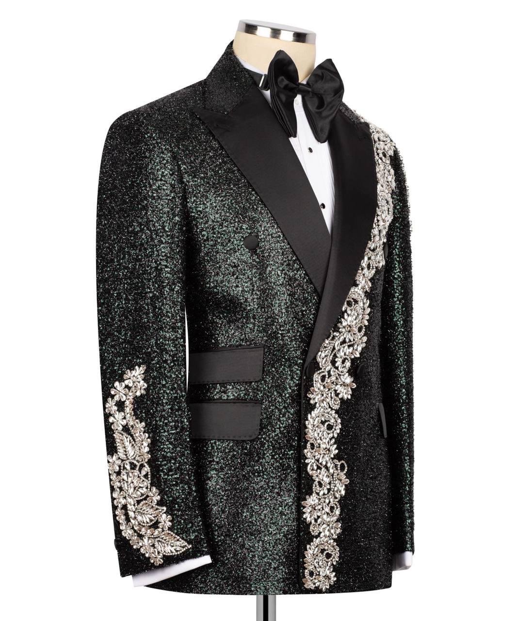 Elegant black tuxedo with floral embroidery on a white background