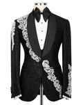 Black tuxedo with white embroidery on a mannequin against a white background