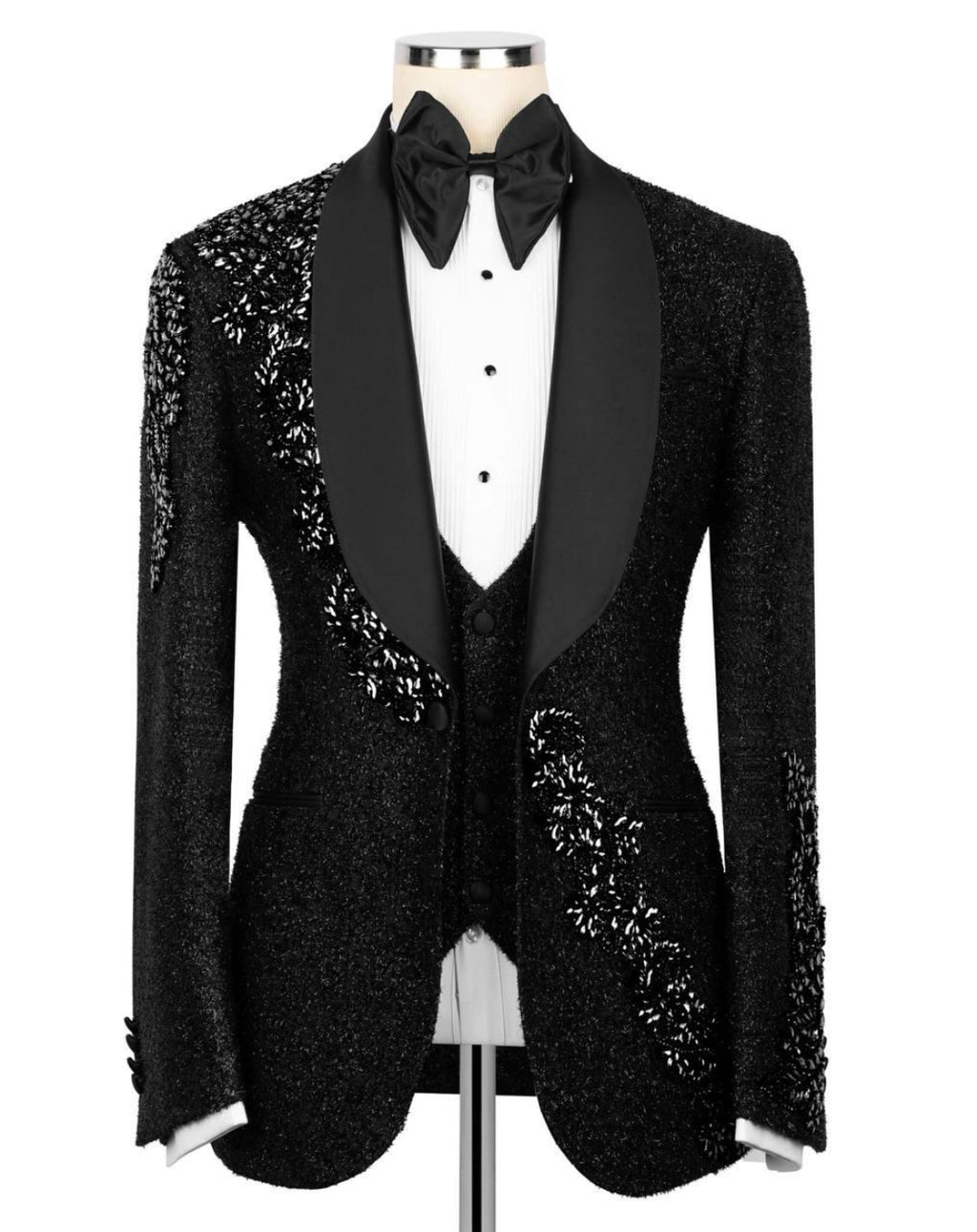 Black tuxedo with sequin details on a mannequin against a white background