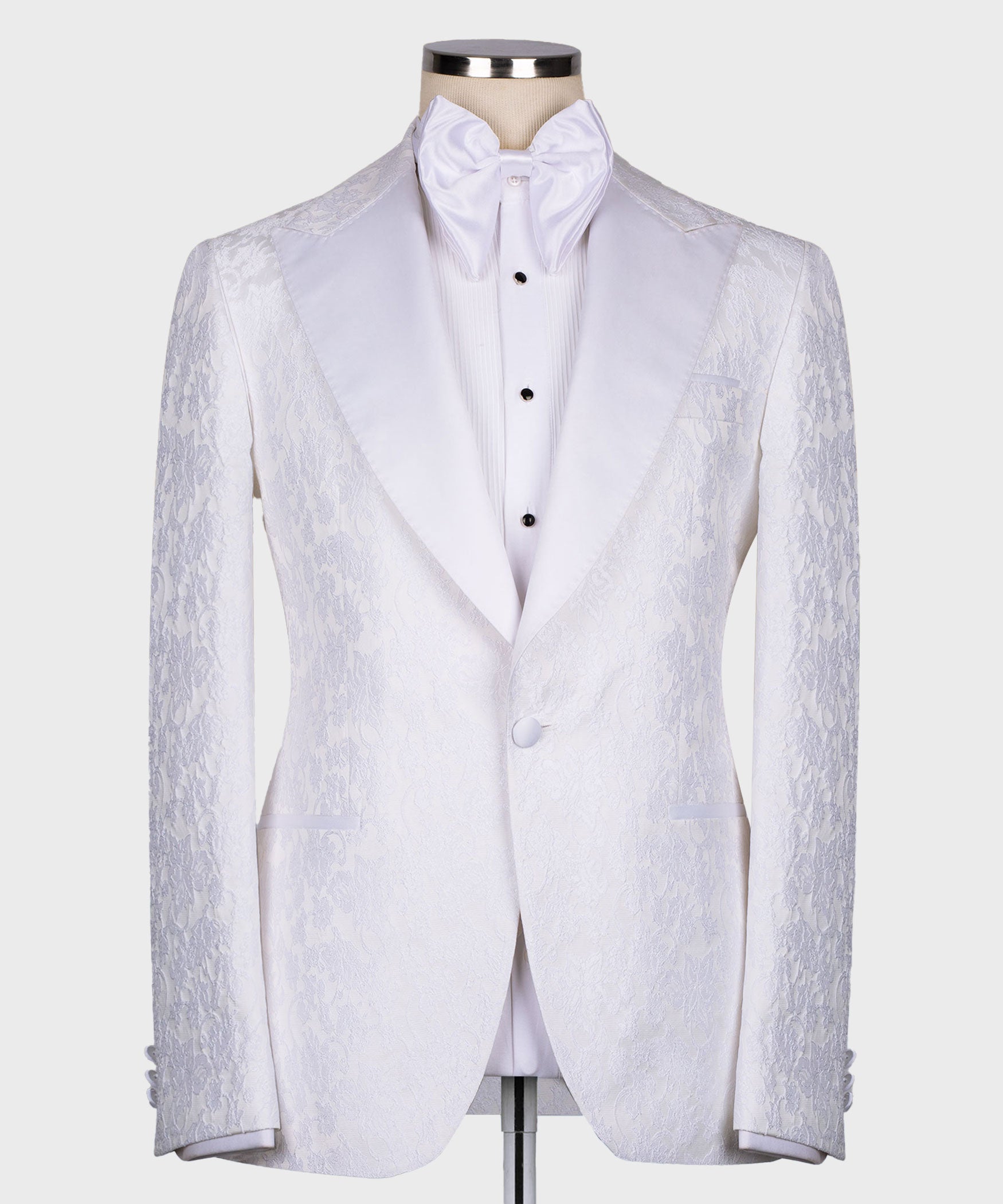 White tuxedo three-piece suit set: pointed-collar jacket, waistcoat front, button details