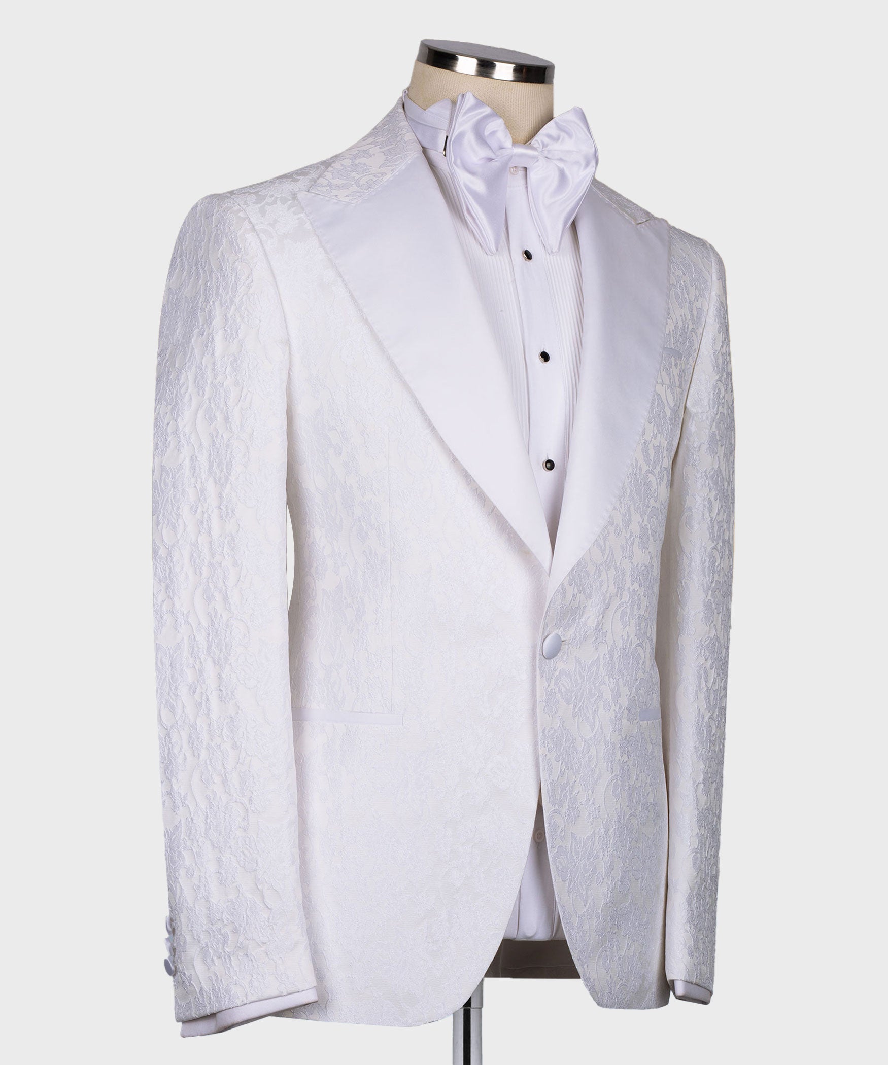 White tuxedo jacket with pointed collar and waistcoat, bow tie at neckline