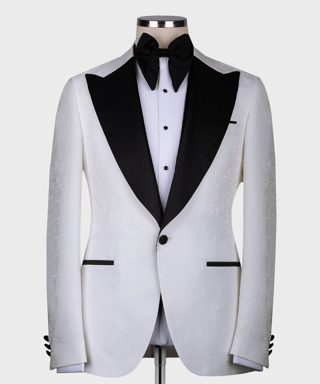 White tuxedo jacket with black lapels and bow tie, three-piece formal suit look