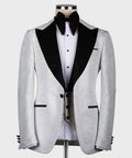 Light gray tuxedo jacket with pointed black satin lapels and black bow tie