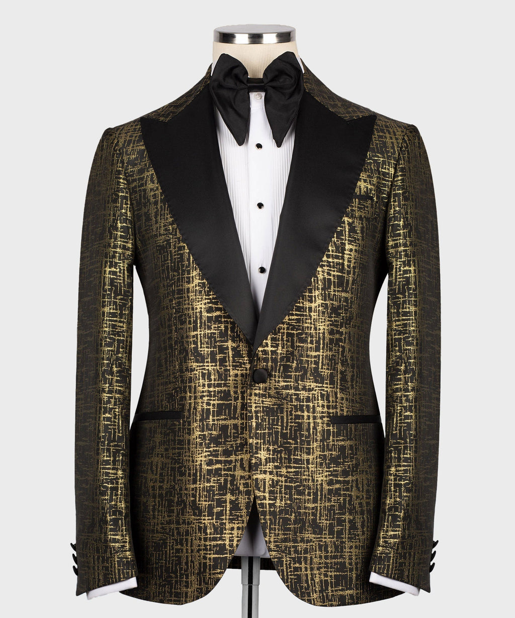 Black bow tie and pointed-collar white shirt under gold patterned tuxedo jacket