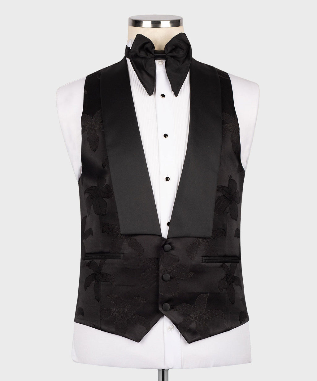 Black three-piece tuxedo set with bow tie, floral jacquard vest, and matching jacket
