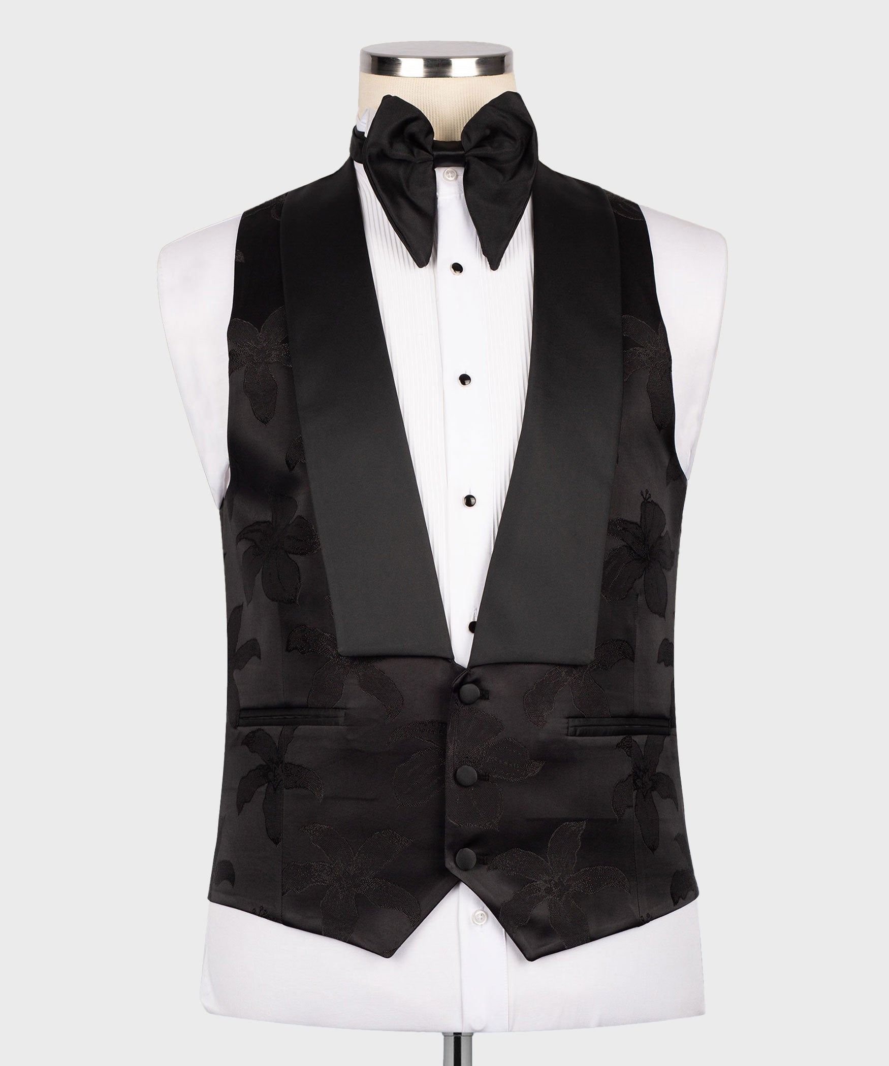 Black three-piece tuxedo set with bow tie, floral jacquard vest, and matching jacket