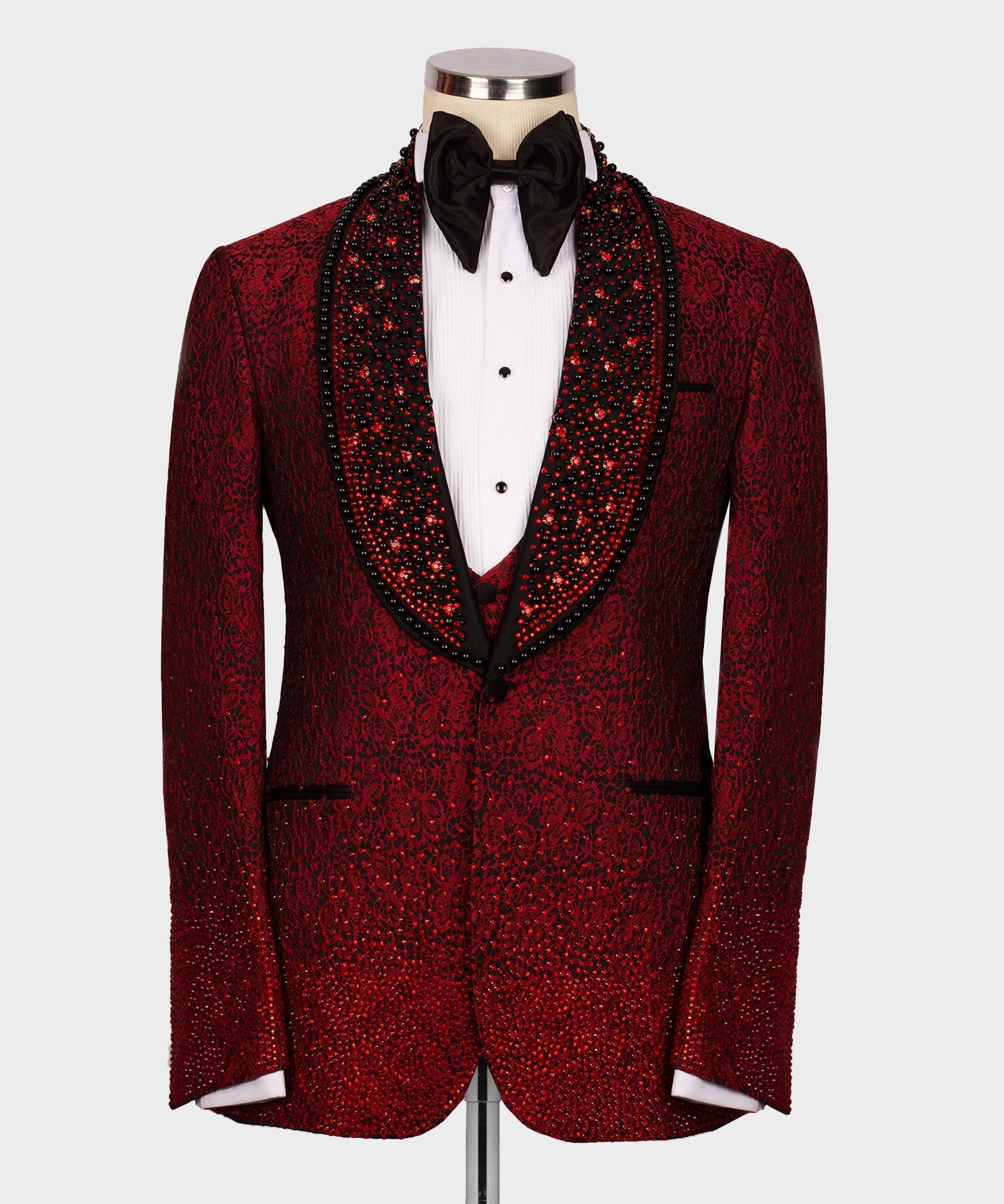 Front view of the luxurious Koss Atelier crimson red floral lace tuxedo jacket featuring a hand-beaded black shawl lapel and ombré crystal hem.