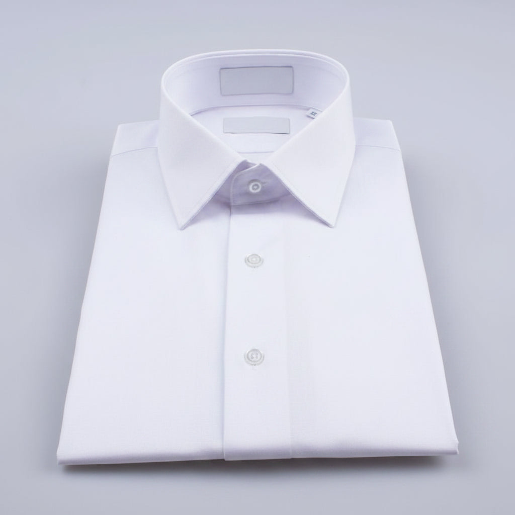 Close-up shot highlighting the high-thread-count vertical pleats and contrasting black hardware on a warm ivory tuxedo shirt.