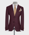 Burgundy three-piece suit jacket with vest, patterned gold tie, and matching pocket square